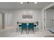 Cozy dining area with stylish seating, soft lighting, and convenient access to the kitchen and entryways at 470 Leach St, Englewood, FL 34223