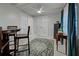 Dining area featuring tile flooring, bar-height seating, and a view of the bedroom at 470 Leach St, Englewood, FL 34223