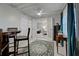 Inviting dining area with tile flooring, stylish furniture, and a view into the bedroom at 470 Leach St, Englewood, FL 34223