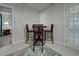 This dining area includes tile flooring, a bar-height table, and a view into another room at 470 Leach St, Englewood, FL 34223