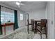 Cozy dining area boasts tile floors, elegant furniture, and a view of the outdoors at 470 Leach St, Englewood, FL 34223