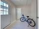 Welcoming entryway with light tile flooring, a door to the outside, and interior door at 470 Leach St, Englewood, FL 34223
