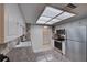 The kitchen offers great counter space, stone backsplash and stainless steel appliances at 470 Leach St, Englewood, FL 34223