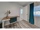 Charming office space with an elegant desk and chair next to a window with stylish curtains at 470 Leach St, Englewood, FL 34223