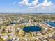 Beautiful aerial view of home in lakeside community with mature landscaping and serene water views on a sunny day at 4809 11Th Avenue E Cir, Bradenton, FL 34208