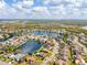 Scenic aerial view of a lakeside home featuring lush landscaping, and beautiful lake views in a quiet neighborhood at 4809 11Th Avenue E Cir, Bradenton, FL 34208