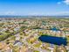 Great aerial view of home in a lakeside community near a canal, featuring lush landscaping, and serene water views at 4809 11Th Avenue E Cir, Bradenton, FL 34208