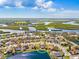 Beautiful aerial view of a lakeside home near local amenities with mature landscaping and serene water views at 4809 11Th Avenue E Cir, Bradenton, FL 34208