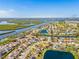 Great aerial view of home near the Gulf and Braden River, featuring lush landscaping and beautiful lake views at 4809 11Th Avenue E Cir, Bradenton, FL 34208