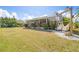 Spacious backyard with a hammock swing and a screened-in lanai at 4809 11Th Avenue E Cir, Bradenton, FL 34208