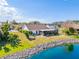 Backyard and screened in patio of a waterfront home with mature trees at 4809 11Th Avenue E Cir, Bradenton, FL 34208