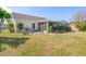 Expansive backyard featuring multiple outdoor spaces including screened patio and sunroom at 4809 11Th Avenue E Cir, Bradenton, FL 34208