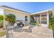 Cozy backyard patio with a seating area, blending seamlessly with the surrounding greenery at 4809 11Th Avenue E Cir, Bradenton, FL 34208