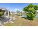 A serene backyard with a view of the lake and mature landscaping at 4809 11Th Avenue E Cir, Bradenton, FL 34208