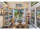Charming breakfast nook with a glass table, seating for four, and natural light at 4809 11Th Avenue E Cir, Bradenton, FL 34208