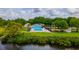 Community pool and playground with lush landscaping and gazebo near the lake at 4809 11Th Avenue E Cir, Bradenton, FL 34208