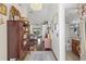 View of the foyer that leads to a large living room and full bathroom at 4809 11Th Avenue E Cir, Bradenton, FL 34208