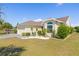 Charming single Gathering home featuring a two-car garage, well-manicured lawn and lovely landscaping at 4809 11Th Avenue E Cir, Bradenton, FL 34208