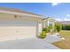 Charming single Gathering home featuring a two-car garage, well-manicured lawn and lovely landscaping at 4809 11Th Avenue E Cir, Bradenton, FL 34208