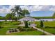 Community gazebo with seating, set amidst lush landscaping with lake views at 4809 11Th Avenue E Cir, Bradenton, FL 34208