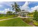 Community gazebo with picnic tables overlooks lush landscaping and the lake at 4809 11Th Avenue E Cir, Bradenton, FL 34208