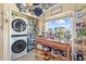 Laundry room with white washer and dryer and plenty of pantry storage at 4809 11Th Avenue E Cir, Bradenton, FL 34208