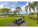 Community picnic area with picnic table and grill, with a view of the lake at 4809 11Th Avenue E Cir, Bradenton, FL 34208