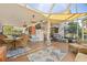 Large sunroom with dining and seating areas, perfect for relaxation and enjoying the outdoor ambiance at 4809 11Th Avenue E Cir, Bradenton, FL 34208