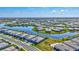 High-angle view of a neighborhood with serene waterways flowing between numerous neatly arranged homes at 4968 Seafoam Trl, Bradenton, FL 34211