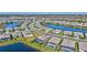 Beautiful aerial view of a community with houses surrounding picturesque ponds and lush landscaping at 4968 Seafoam Trl, Bradenton, FL 34211