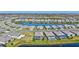 Panoramic aerial view of a residential community with houses, lawns, ponds, and mature landscaping at 4968 Seafoam Trl, Bradenton, FL 34211