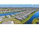 Overhead view of a community featuring numerous homes along winding waterways and lush landscaping at 4968 Seafoam Trl, Bradenton, FL 34211