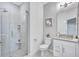 Modern bathroom featuring granite countertop, glass shower, and contemporary fixtures at 4968 Seafoam Trl, Bradenton, FL 34211