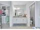 Well-lit bathroom features double sinks, granite countertops, a walk-in closet, and a separate toilet room at 4968 Seafoam Trl, Bradenton, FL 34211