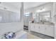 Bathroom features a large frameless shower, double sinks, and granite countertops with lots of storage space at 4968 Seafoam Trl, Bradenton, FL 34211