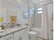Well-lit bathroom with a granite vanity, framed mirror, shower-tub combo, and neutral decor at 4968 Seafoam Trl, Bradenton, FL 34211