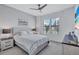 Bright bedroom with a ceiling fan, beachy decor, natural light, and a comfy bed at 4968 Seafoam Trl, Bradenton, FL 34211