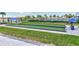 Scenic bocce ball courts in a community with manicured lawns and shaded seating areas at 4968 Seafoam Trl, Bradenton, FL 34211