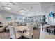 Inviting and spacious dining area with plenty of seating, natural light, and neutral tones at 4968 Seafoam Trl, Bradenton, FL 34211