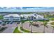 The community clubhouse featuring modern architecture, lush landscaping, and convenient parking at 4968 Seafoam Trl, Bradenton, FL 34211