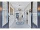 Inviting foyer with tile flooring, elegant lighting, and an open view into the living spaces at 4968 Seafoam Trl, Bradenton, FL 34211