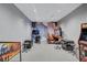 Community game room featuring video arcade driving and battle games and seating at 4968 Seafoam Trl, Bradenton, FL 34211
