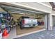 Organized garage interior showcasing a silver truck, golf cart, and storage shelves for convenience at 4968 Seafoam Trl, Bradenton, FL 34211
