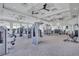 Bright community gym featuring modern weight training machines, ceiling fans, and plenty of natural light at 4968 Seafoam Trl, Bradenton, FL 34211