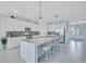 Bright kitchen with a central island, stylish pendant lights, and stainless steel appliances at 4968 Seafoam Trl, Bradenton, FL 34211
