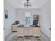 Bright home office featuring a large wooden desk, stylish lighting, and decorative built-in shelving at 4968 Seafoam Trl, Bradenton, FL 34211