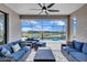 Covered patio with comfortable seating and a view of the beautiful pool and backyard oasis at 4968 Seafoam Trl, Bradenton, FL 34211