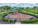 Community playground with swings, slides, and climbing structures at 4968 Seafoam Trl, Bradenton, FL 34211