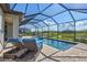 Screened-in pool area features a spacious patio, in-ground pool, and lounge chairs for outdoor enjoyment at 4968 Seafoam Trl, Bradenton, FL 34211