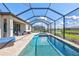 Inviting screened-in pool with a spa and serene outdoor seating area perfect for relaxation and entertaining at 4968 Seafoam Trl, Bradenton, FL 34211